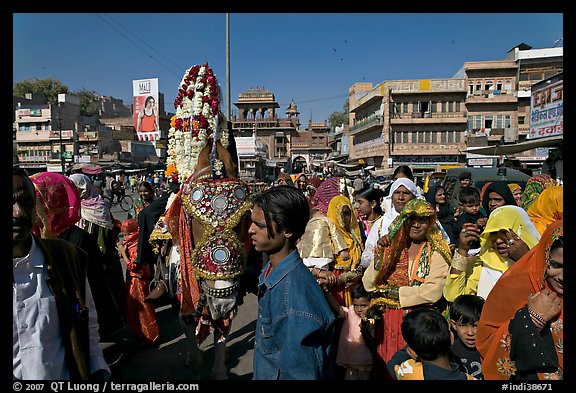 Wedding procession with flower-covered groom on horse. Jodhpur, Rajasthan, India