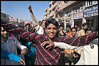 Young men celebrating during wedding procession. Jodhpur, Rajasthan, India (color)