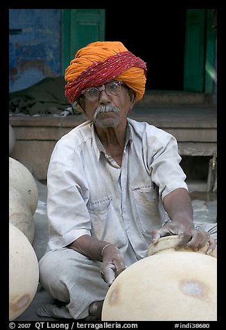 Man with turban holding a jar. Jodhpur, Rajasthan, India