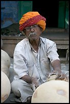 Man with turban holding a jar. Jodhpur, Rajasthan, India ( color)