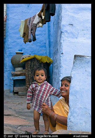 Baby girl and woman in blue alley. Jodhpur, Rajasthan, India