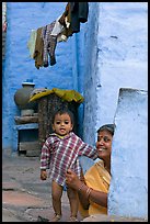 Baby girl and woman in blue alley. Jodhpur, Rajasthan, India ( color)