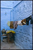 Laundry in alley with whitewashed walls tinted indigo. Jodhpur, Rajasthan, India ( color)