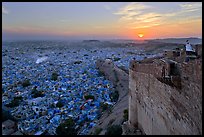 Mehrangarh Fort walls, blue houses, and setting sun. Jodhpur, Rajasthan, India (color)