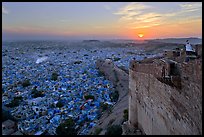 Mehrangarh Fort walls, blue houses, and setting sun. Jodhpur, Rajasthan, India