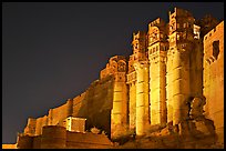 Towers and 36m high walls of Mehrangarh Fort by night. Jodhpur, Rajasthan, India (color)