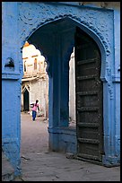 Archway with woman carrying water in courtyard. Jodhpur, Rajasthan, India (color)