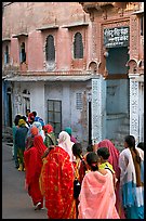 Women walking in a narrow old town street. Jodhpur, Rajasthan, India (color)