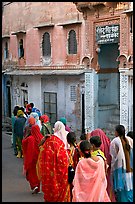 Women walking in a narrow old town street. Jodhpur, Rajasthan, India (color)