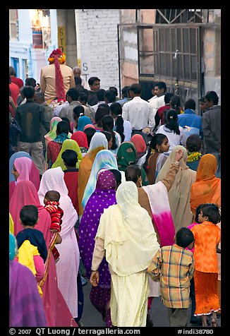 Women following groom during wedding. Jodhpur, Rajasthan, India