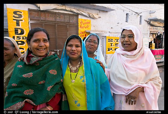 Women wearing hijabs smiling in the street. Jodhpur, Rajasthan, India (color)