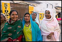 Women wearing hijabs smiling in the street. Jodhpur, Rajasthan, India