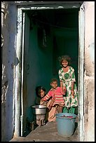 Family inside doorway. Jodhpur, Rajasthan, India