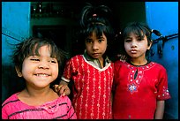 Girls in red dress and blue doors. Jodhpur, Rajasthan, India ( color)