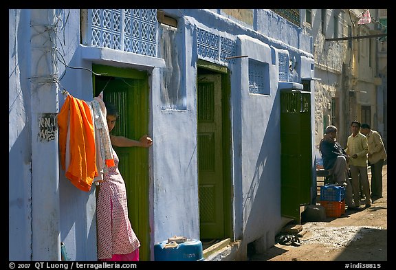 Sunlit street with blue house. Jodhpur, Rajasthan, India