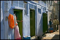 Sunlit street with blue house. Jodhpur, Rajasthan, India