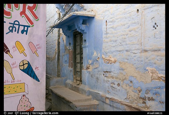 Whitewashed walls with indigo tint and ice-cream depictions. Jodhpur, Rajasthan, India