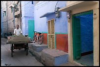 Man with vegetables car in front of painted house. Jodhpur, Rajasthan, India (color)