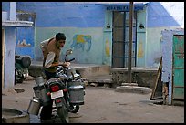 Man with milk delivery motorbike. Jodhpur, Rajasthan, India (color)