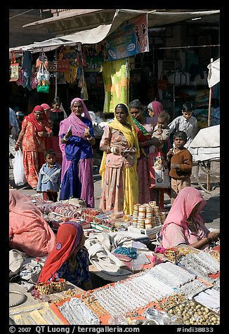 Women looking at jewelry stand in Sardar market. Jodhpur, Rajasthan, India (color)