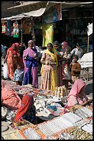 Women looking at jewelry stand in Sardar market. Jodhpur, Rajasthan, India (color)