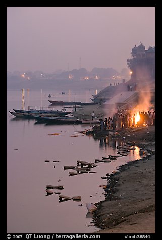 Cremation at Harishchandra Ghat at sunset. Varanasi, Uttar Pradesh, India (color)