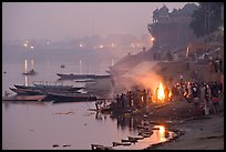 Cremation fire on banks of Ganges River. Varanasi, Uttar Pradesh, India ( color)