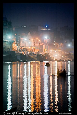 Lights reflected in the Ganga River at night. Varanasi, Uttar Pradesh, India