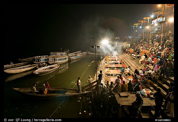 Boat and Dasaswamedh Ghat at the start of evening puja. Varanasi, Uttar Pradesh, India (color)