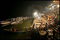 Boat and Dasaswamedh Ghat at the start of evening puja. Varanasi, Uttar Pradesh, India