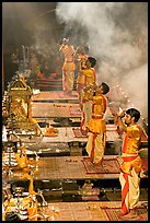 Young priests open Puja ceremony by blowing a conch-shell. Varanasi, Uttar Pradesh, India ( color)