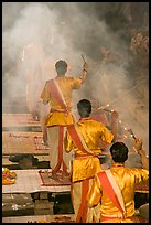 Brahmans standing amongst clouds of incense during puja. Varanasi, Uttar Pradesh, India (color)