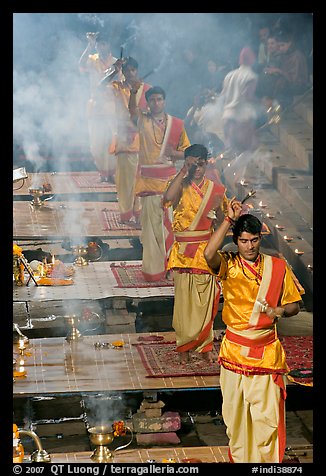 Five young Brahmans performing puja ceremony in the evening. Varanasi, Uttar Pradesh, India (color)