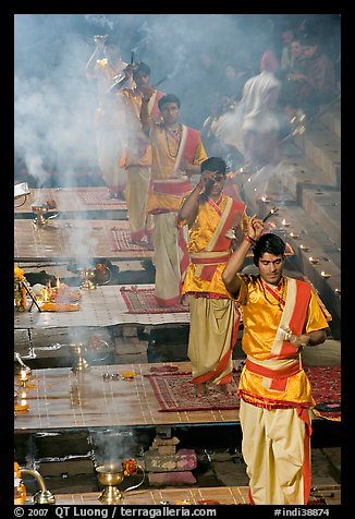 Five young Brahmans performing puja ceremony in the evening. Varanasi, Uttar Pradesh, India