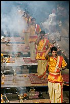 Five young Brahmans performing puja ceremony in the evening. Varanasi, Uttar Pradesh, India (color)