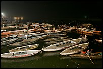 Boats on the Ganges River at night during arti ceremony. Varanasi, Uttar Pradesh, India