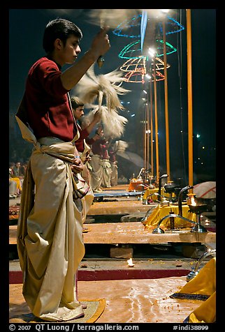 Young Brahman performing arti ceremony. Varanasi, Uttar Pradesh, India