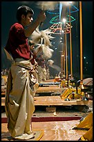 Young Brahman performing arti ceremony. Varanasi, Uttar Pradesh, India