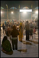 Worshipers during evening arti ceremony at Ganga Seva Nidhi. Varanasi, Uttar Pradesh, India (color)