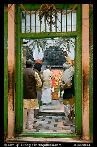 Bell ringing during worship in temple. Varanasi, Uttar Pradesh, India (color)