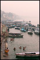 Pilgrims taking a holy dip in the Ganga River at dawn. Varanasi, Uttar Pradesh, India (color)