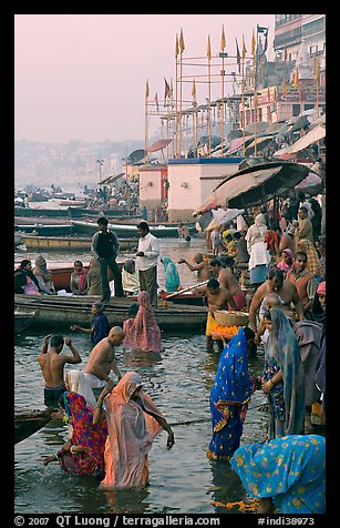 Women standing in Ganga River at sunrise, Dasaswamedh Ghat. Varanasi, Uttar Pradesh, India (color)