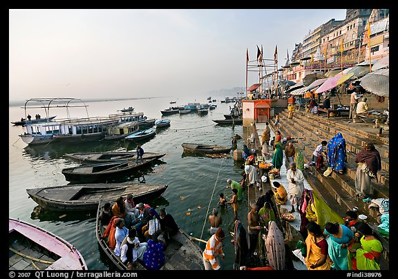 Activity on the steps of Dasaswamedh Ghat, early morning. Varanasi, Uttar Pradesh, India (color)