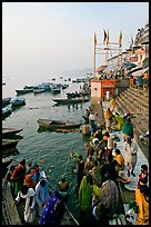 Boat unloading pilgrim onto Dasaswamedh Ghat, early morning. Varanasi, Uttar Pradesh, India ( color)