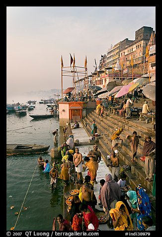 People about to bathe in the Ganga River at sunrise. Varanasi, Uttar Pradesh, India