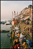 People about to bathe in the Ganga River at sunrise. Varanasi, Uttar Pradesh, India