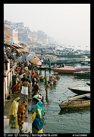 People and boats on the banks of the Ganges River, Dasaswamedh Ghat. Varanasi, Uttar Pradesh, India