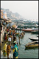 People and boats on the banks of the Ganges River, Dasaswamedh Ghat. Varanasi, Uttar Pradesh, India