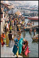 Gathering on the banks of Ganges River, sunrise. Varanasi, Uttar Pradesh, India (color)