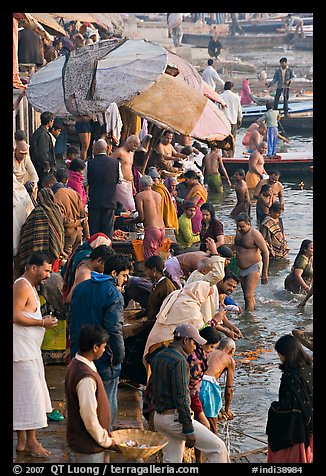 Colorful crowd at the edge of water, Dasaswamedh Ghat. Varanasi, Uttar Pradesh, India (color)